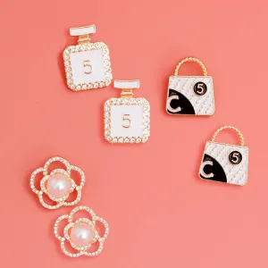 Glamorous Trio: Gold and White Chanel Earrings