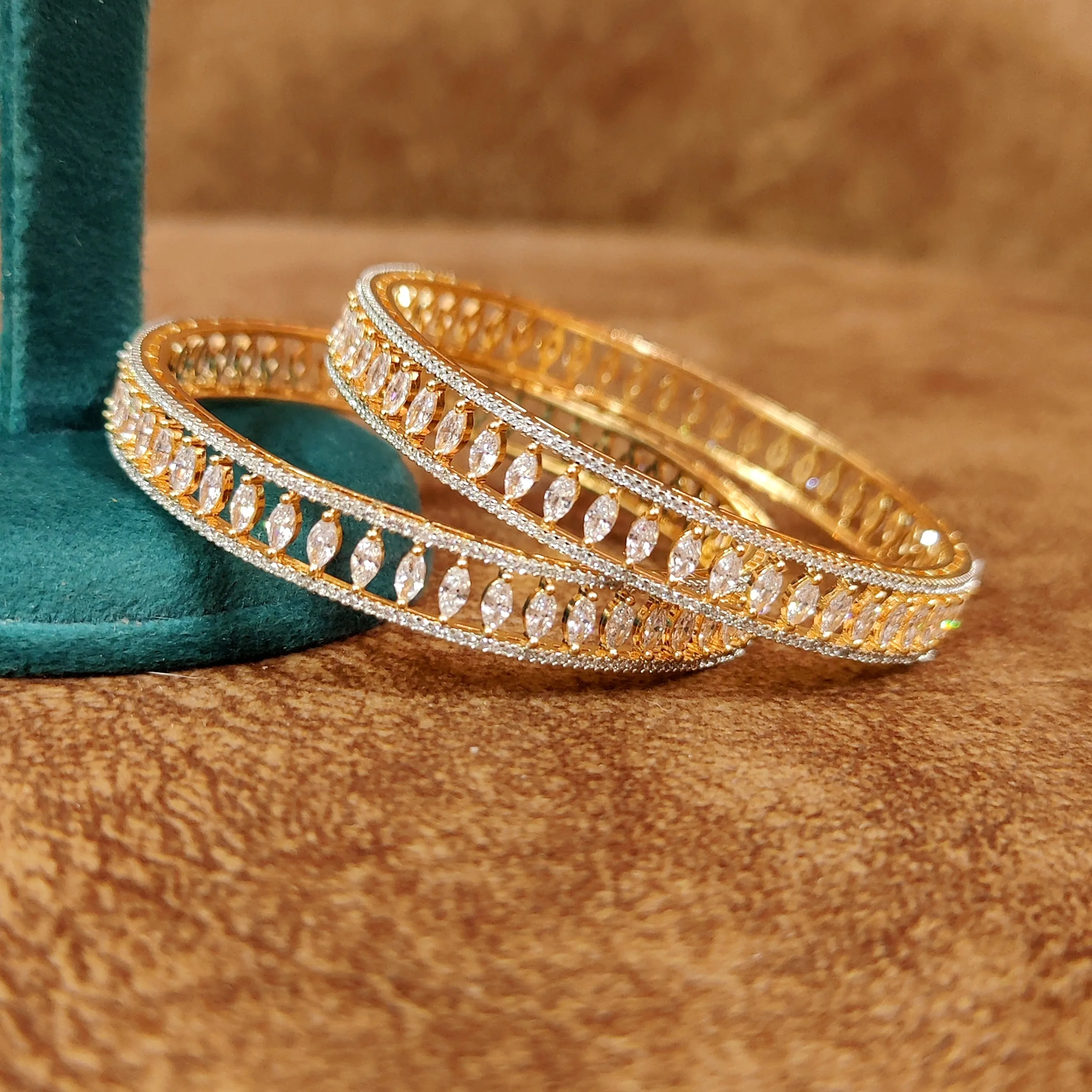 MARQUESE SHAPED AD STUDDED GOLD BANGLES